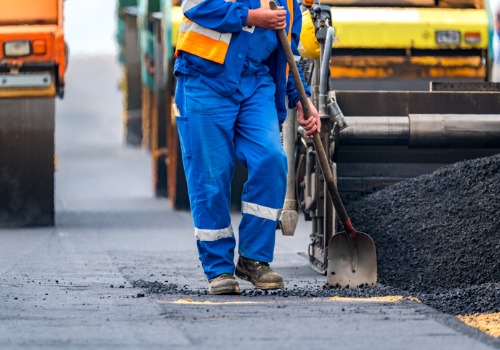 A crew member repairs a road. If you have crack repairs to take care of, you need the best Crack Sealers Illinois has to offer.