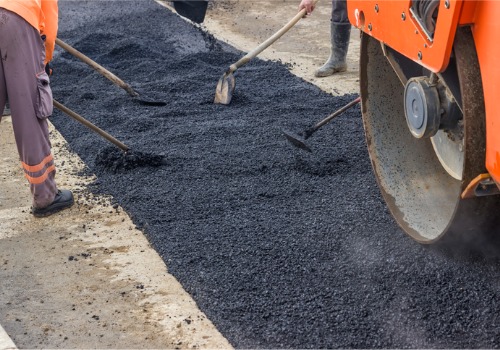 An asphalt crew patches a road. They rely on the Best Crack Sealers Arizona has to offer from Etnyre.