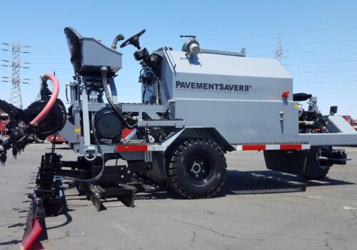 A grey sealcoat buggy designed and manufactured by Etnyre