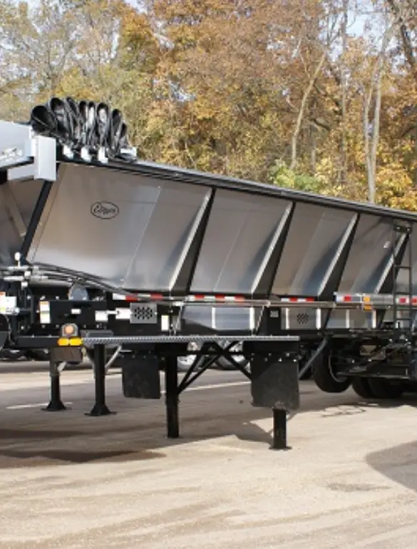 A live bottom trailer is part of Etnyre’s road construction equipment